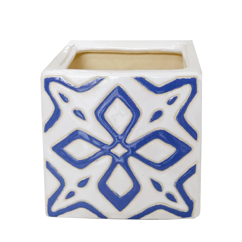 Square glazed ceramic pot with a blue and white relief pattern