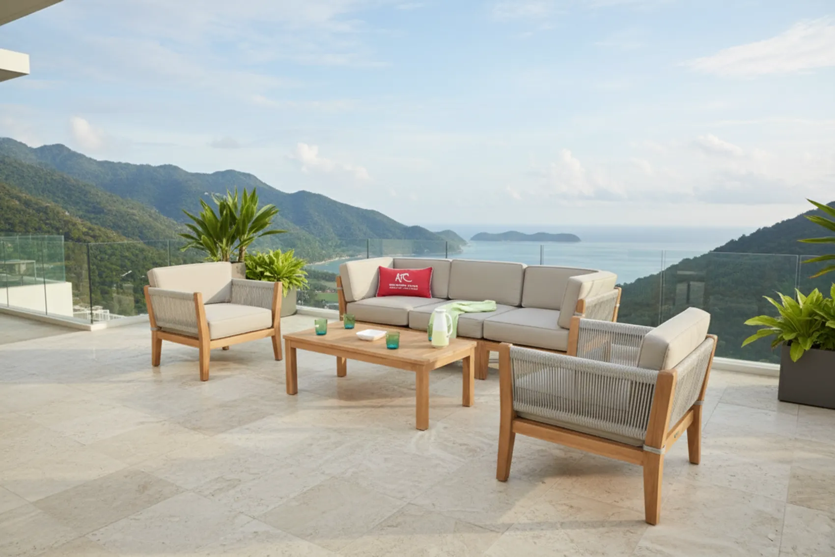 Teak sofa set with a coffee table on a terrace above the sea