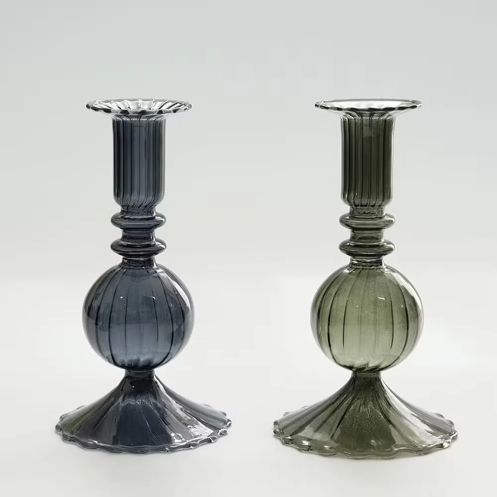 Pair of dark blue and green ribbed glass candlestick holders