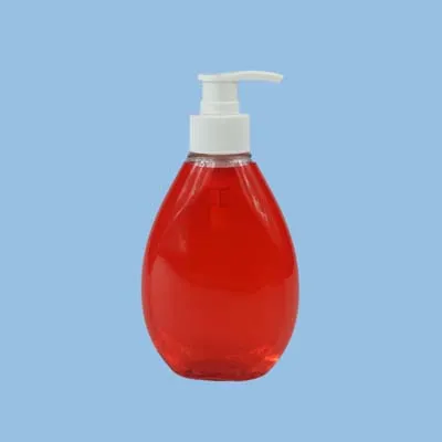Clear plastic teardrop bottle with red liquid and a white pump head