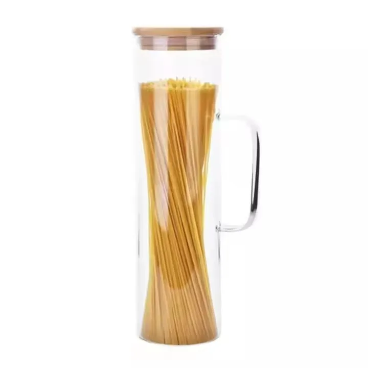 Tall glass jar with a bamboo lid holding spaghetti