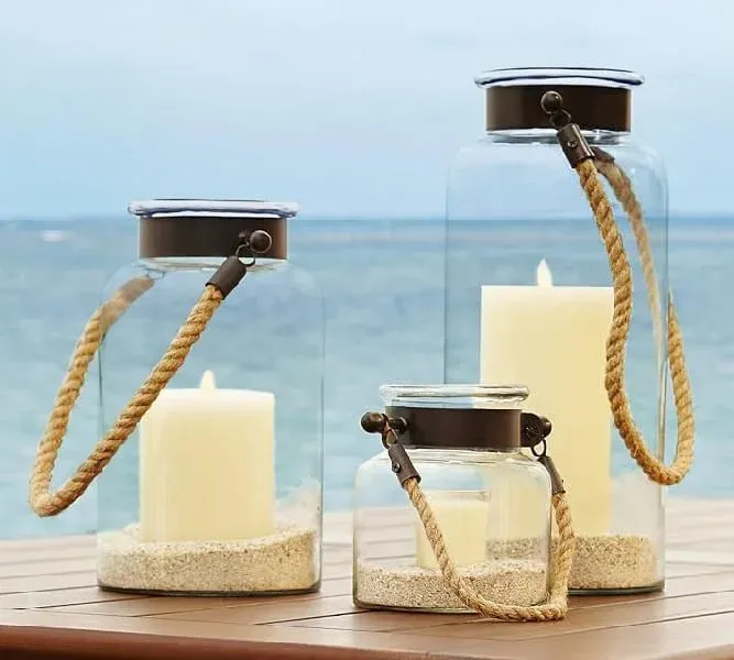 Glass lantern jars with rope handles and candles