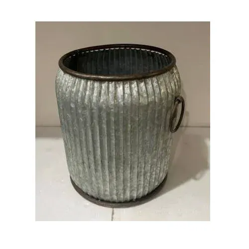Round galvanized metal planter with ribbed sides and two handles